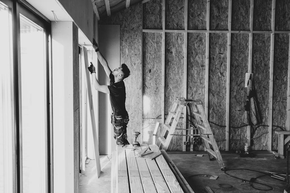 Contractor discussing window installation details with homeowners